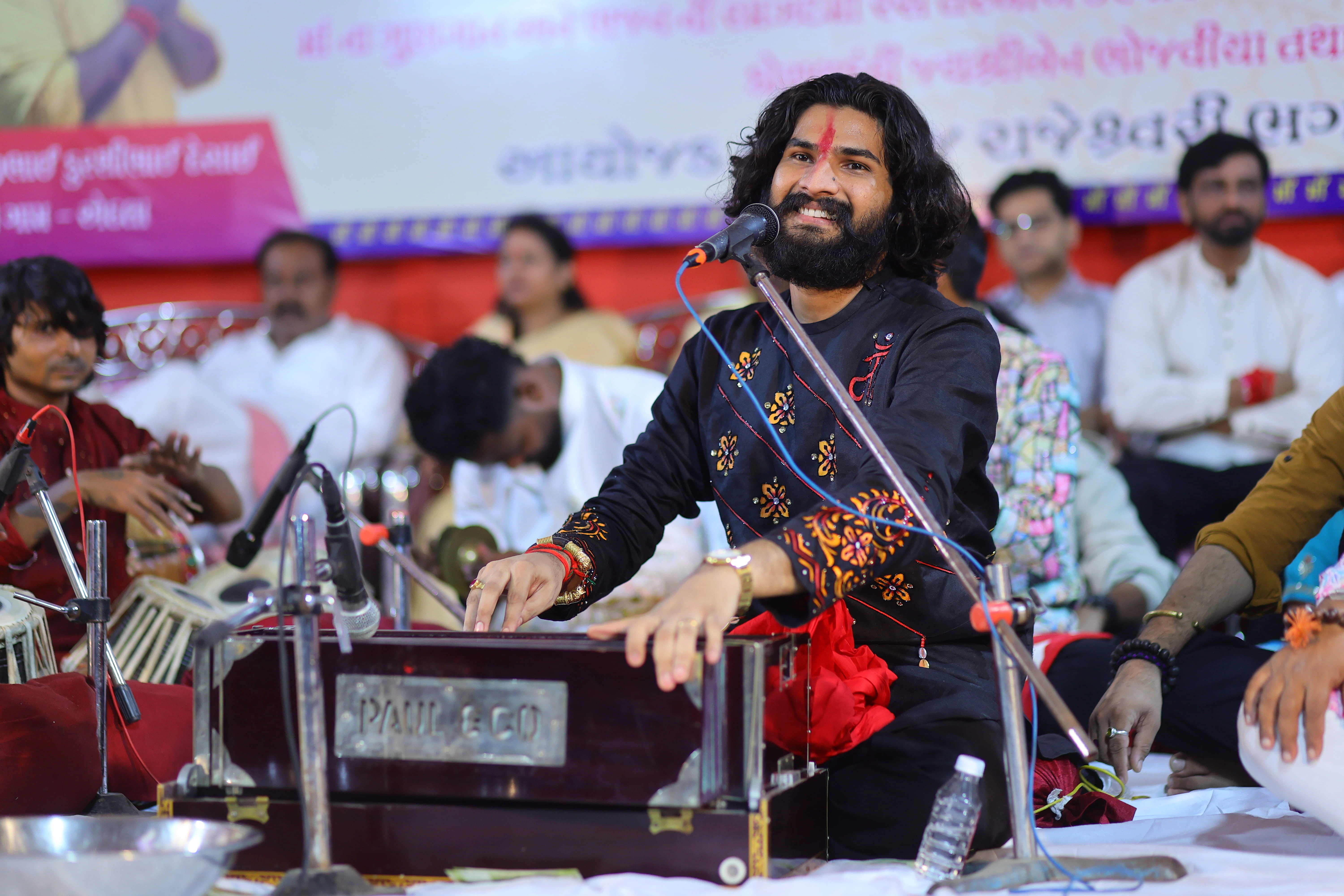 Nirav Barot greeting the audience on stage
